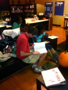 Chris Sax helps YLLC Easley students with their homework.